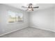 Bright and airy bedroom featuring plush carpet, and a large window for natural light at 13616 N 41 Pl, Phoenix, AZ 85032