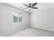 A light-filled bedroom includes a ceiling fan and a window at 13616 N 41 Pl, Phoenix, AZ 85032