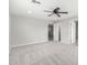 Neutral bedroom featuring a ceiling fan, plush carpet, and a bright, open feel at 13616 N 41 Pl, Phoenix, AZ 85032