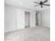 Bright bedroom showcasing neutral colors, plush carpet, and a walk-in closet at 13616 N 41 Pl, Phoenix, AZ 85032