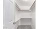 Walk-in closet featuring built-in shelving and ample storage space at 13616 N 41 Pl, Phoenix, AZ 85032