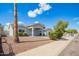 Well-maintained single-story home featuring desert landscaping and a covered entrance, offering curb appeal at 13616 N 41 Pl, Phoenix, AZ 85032