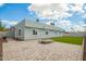 View of the backyard with artificial turf and desert landscaping at 13616 N 41 Pl, Phoenix, AZ 85032