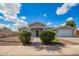Charming single-story home with a well-manicured yard and inviting entrance, perfect for suburban living at 13616 N 41 Pl, Phoenix, AZ 85032