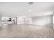 Expansive open-concept living area with sleek wood-look tile flooring and ample natural light, ideal for gatherings at 13616 N 41 Pl, Phoenix, AZ 85032