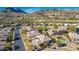 Aerial view of neighborhood with desert landscape, golf course and mountain views at 14808 E Miramonte Way, Fountain Hills, AZ 85268