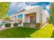 Manicured backyard, patio, and pool view from a modern home at 14808 E Miramonte Way, Fountain Hills, AZ 85268