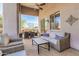 Covered patio seating area with stylish outdoor furniture at 14808 E Miramonte Way, Fountain Hills, AZ 85268
