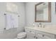 Bathroom with a white vanity, a framed mirror, and a toilet with a towel rack at 14808 E Miramonte Way, Fountain Hills, AZ 85268