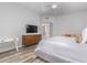 Bedroom featuring wood floors, neutral color palette, and a functional workspace, creating a comfortable living space at 14808 E Miramonte Way, Fountain Hills, AZ 85268