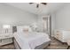 Cozy bedroom with a bed, ceiling fan, and natural light from the window, creating a calming atmosphere at 14808 E Miramonte Way, Fountain Hills, AZ 85268