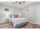 Bedroom with wood floors, ceiling fan, two side tables, with access to the bathroom at 14808 E Miramonte Way, Fountain Hills, AZ 85268