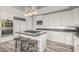 Open-concept kitchen features a large island, stainless appliances, and stylish wood flooring at 14808 E Miramonte Way, Fountain Hills, AZ 85268