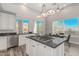 Bright kitchen with white cabinets, granite counters, and stainless steel appliances at 14808 E Miramonte Way, Fountain Hills, AZ 85268
