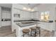 Kitchen with an island, black granite countertops, white cabinets, and stainless steel appliances at 14808 E Miramonte Way, Fountain Hills, AZ 85268