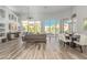 Open concept living room with dining area and floor to ceiling windows with backyard view at 14808 E Miramonte Way, Fountain Hills, AZ 85268