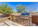 Outdoor kitchen with built-in grill and counter space, ideal for entertaining and summer barbecues at 14808 E Miramonte Way, Fountain Hills, AZ 85268