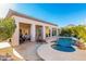 Outdoor patio and kidney-shaped pool with stone surround and mountain views at 14808 E Miramonte Way, Fountain Hills, AZ 85268