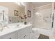 Bathroom with a shower-tub combo, a large mirror, and a sink at 15481 W Amelia Dr, Goodyear, AZ 85395