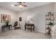 A quaint bedroom with carpet, vintage-style furnishings, and soft, natural lighting at 15481 W Amelia Dr, Goodyear, AZ 85395