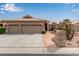 Charming single-story home with a three-car garage and desert landscaping in a sunny neighborhood at 15481 W Amelia Dr, Goodyear, AZ 85395