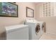 Laundry room with a washing machine and dryer at 15481 W Amelia Dr, Goodyear, AZ 85395
