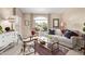 Cozy living room featuring natural light and neutral decor and comfortable seating at 15481 W Amelia Dr, Goodyear, AZ 85395