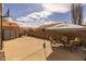 Outdoor patio with basketball hoop, shed, table, and chairs at 1648 S Faith --, Mesa, AZ 85209