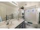 Bathroom with a double sink, a shower-tub, and bright natural light at 1648 S Faith --, Mesa, AZ 85209