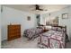 Cozy bedroom with two twin beds, soft blue walls, and a window at 1648 S Faith --, Mesa, AZ 85209