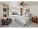 Charming bedroom featuring a window seat, built-in shelves, and ceiling fan at 1648 S Faith --, Mesa, AZ 85209