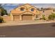 Charming two-story home featuring a three-car garage, tile roof, well-maintained landscaping, and a cozy front entryway at 1648 S Faith --, Mesa, AZ 85209
