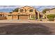 Charming two-story home featuring a three-car garage, tile roof, well-maintained landscaping, and a cozy front entryway at 1648 S Faith --, Mesa, AZ 85209