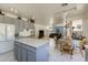 Bright and spacious kitchen with an island, light grey cabinets, and an open layout that connects to the dining and living areas at 1648 S Faith --, Mesa, AZ 85209