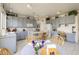 Well-lit kitchen featuring gray cabinets, modern appliances, and a cozy breakfast table at 1648 S Faith --, Mesa, AZ 85209