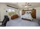 Cozy main bedroom with a ceiling fan, a large window, and built-in wardrobe storage at 1648 S Faith --, Mesa, AZ 85209