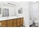 Bathroom featuring double sink vanity and shower/tub combo at 1677 E Heather Dr, San Tan Valley, AZ 85140