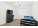Cozy carpeted bedroom with a single bed, dresser, and ceiling fan at 1677 E Heather Dr, San Tan Valley, AZ 85140