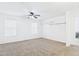 Spacious bedroom with two windows, light walls, and carpeted floors at 1677 E Heather Dr, San Tan Valley, AZ 85140
