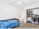 Bedroom with closet and bed with blue patterned comforter and ceiling fan at 1677 E Heather Dr, San Tan Valley, AZ 85140