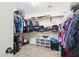 Walk-in closet with clothing, shoes, and accessories organized on shelves at 1677 E Heather Dr, San Tan Valley, AZ 85140