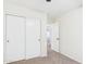 Hallway featuring carpeting and a set of white closet doors at 1677 E Heather Dr, San Tan Valley, AZ 85140