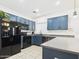 Kitchen featuring modern appliances, tile flooring, and generous counter space at 1677 E Heather Dr, San Tan Valley, AZ 85140
