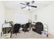 Office with dual desk setup, ceiling fan, and natural light at 1677 E Heather Dr, San Tan Valley, AZ 85140