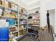 Pantry with various shelving units holding food containers and cooking items at 1677 E Heather Dr, San Tan Valley, AZ 85140