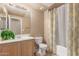 Bathroom featuring a single sink vanity, toilet, and shower-tub combo at 16825 N 14Th St # 125, Phoenix, AZ 85022