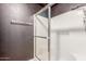 Bathroom featuring a white shower, dark gray accent wall and chrome fixtures at 16825 N 14Th St # 125, Phoenix, AZ 85022