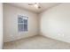 Bright, carpeted bedroom with a window providing natural light at 16825 N 14Th St # 125, Phoenix, AZ 85022