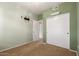 Bedroom featuring light green walls, closet, and mounted TV hookups at 16825 N 14Th St # 125, Phoenix, AZ 85022