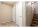 Entryway with tile flooring, coat closet, and staircase leading to upper level at 16825 N 14Th St # 125, Phoenix, AZ 85022